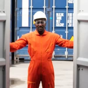 Wind turbines in a field at sunset